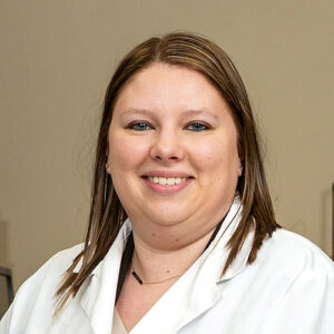 Ashley Sanner headshot in lab coat